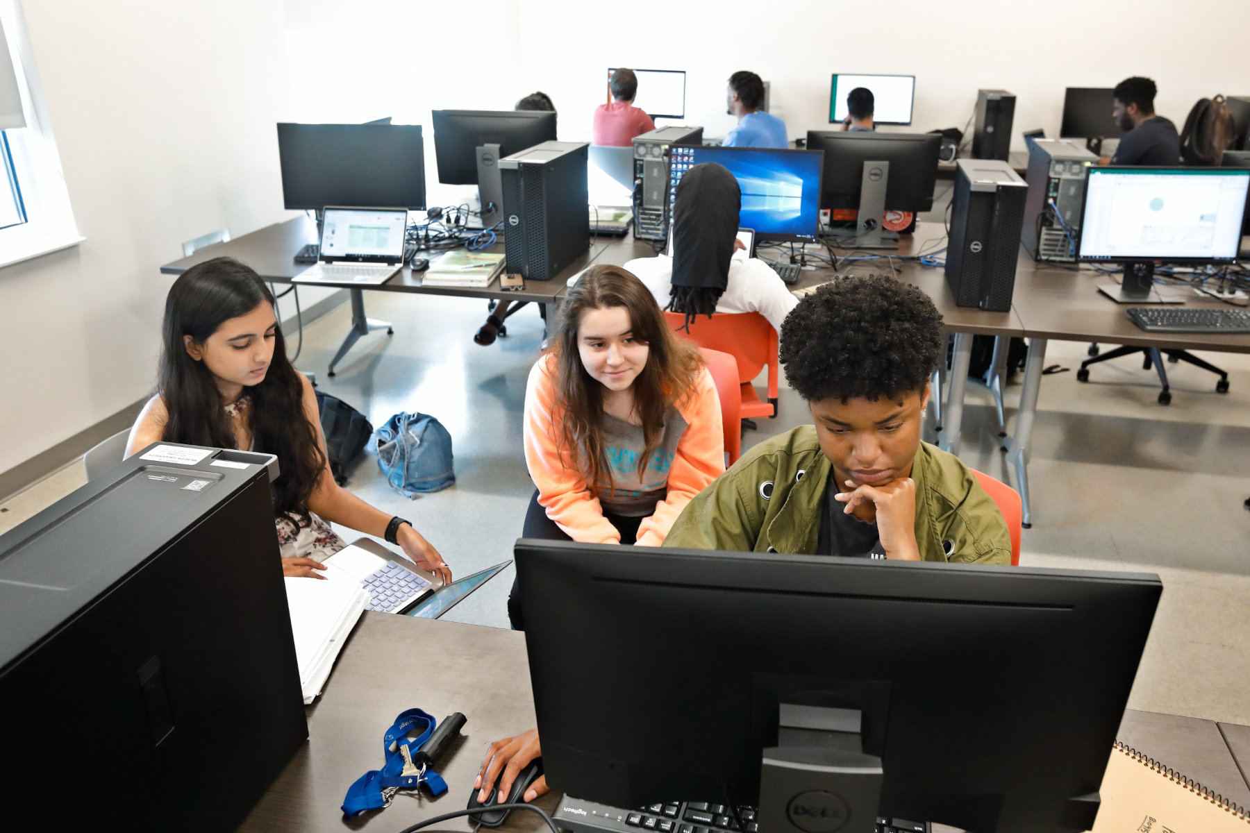 students work on desktop computers
