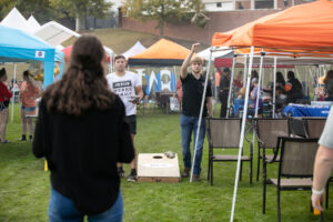 people playing cornhole