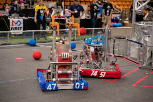 red robot competes against blue robot