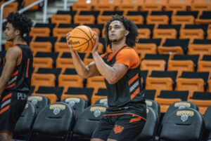 mercer basketball player prepares to shoot ball