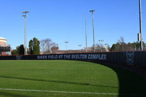 outfield. wall says sikes field at the skelton complex