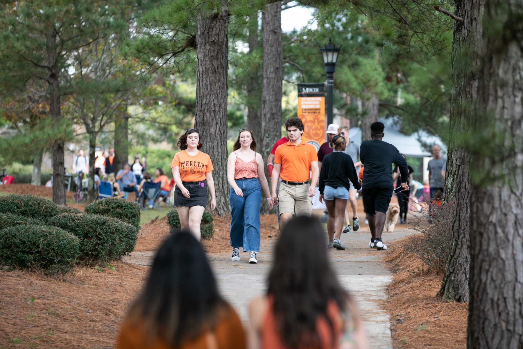 Tailgaters walk on campus