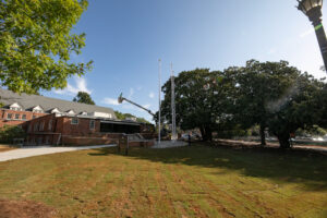 newly sodded greenspace with three flagpoles