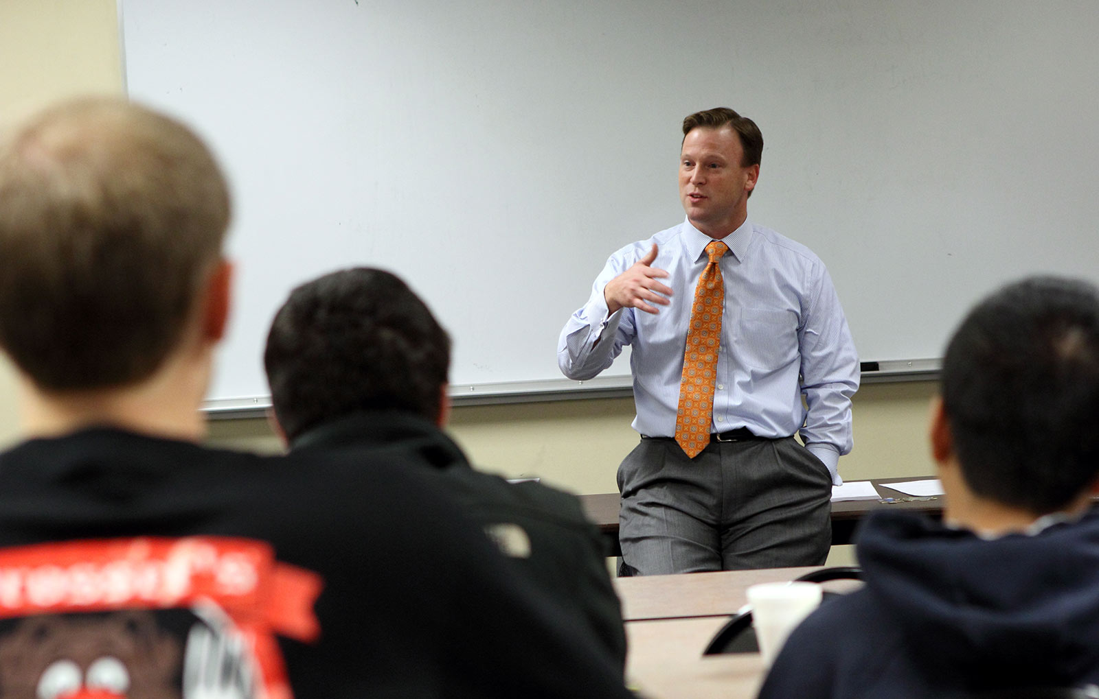 Man speaks to a classroom of students