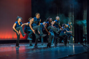 men and women step on stage