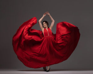 A woman in a flowing red dress.