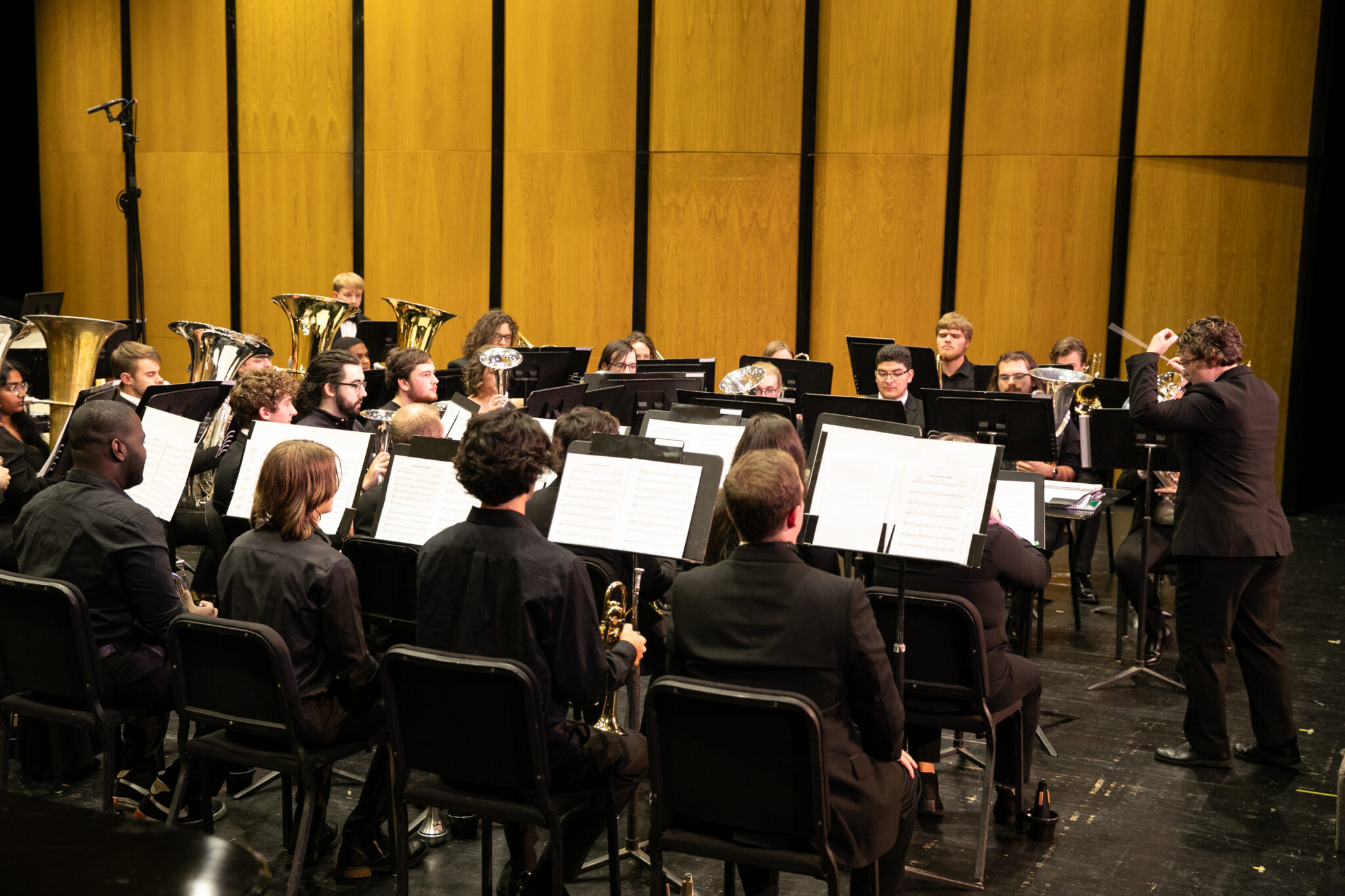 A concert band on stage.