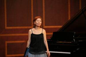 Kyung-A Yoo in a concert hall.