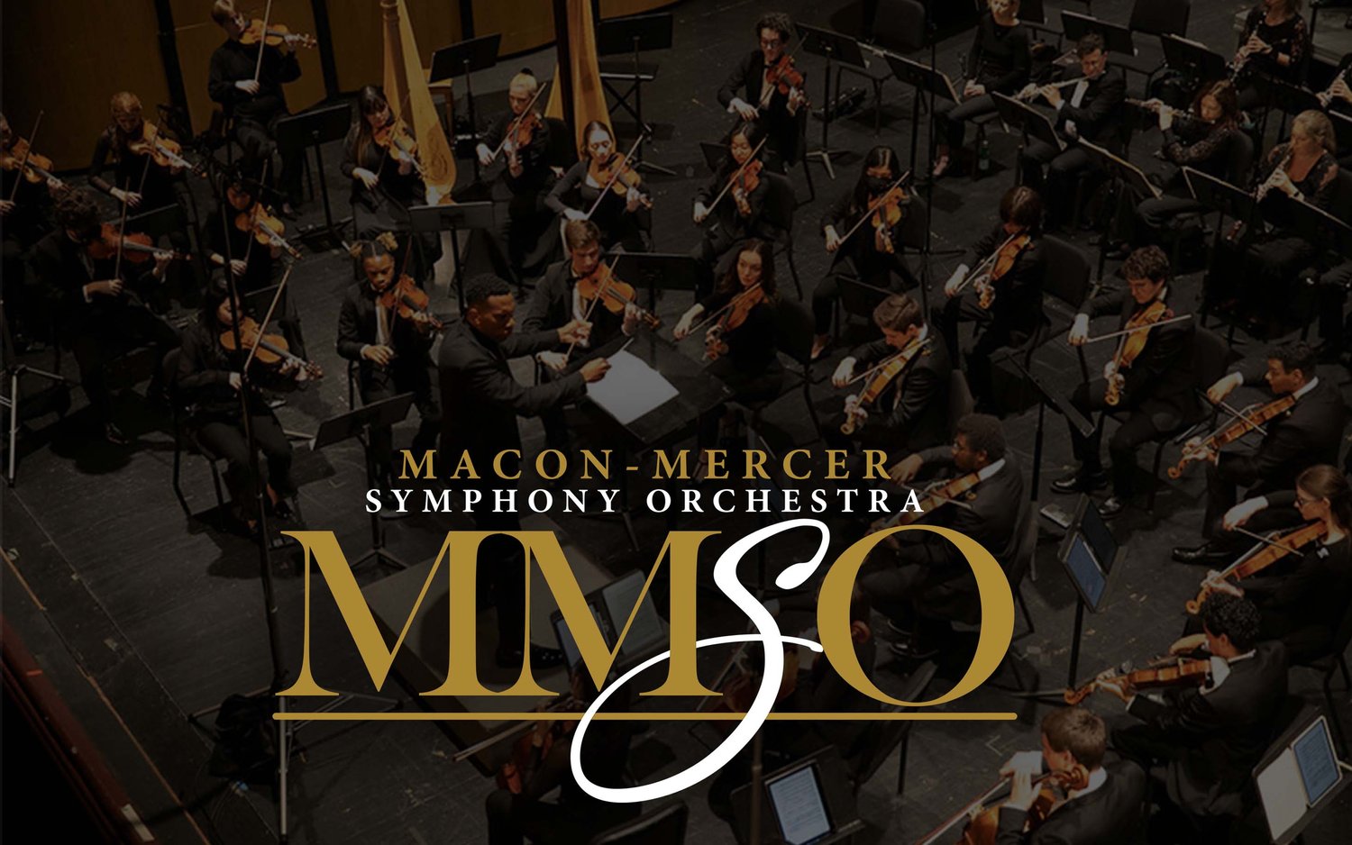 Orchestra musicians performing on stage with the logo and text "Macon-Mercer Symphony Orchestra MMSO" prominently displayed.