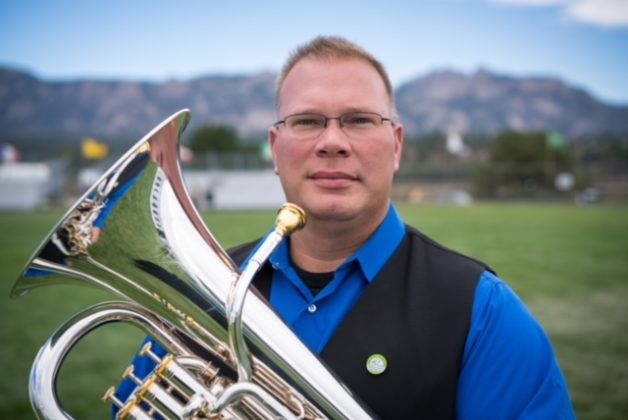 Nate Gay holds a tuba.