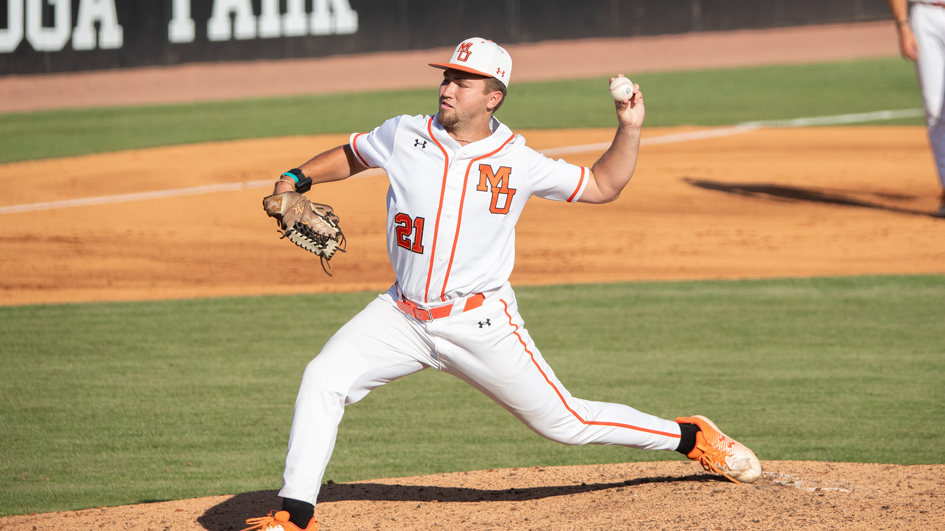 A Mercer baseball player is throwing a ball.