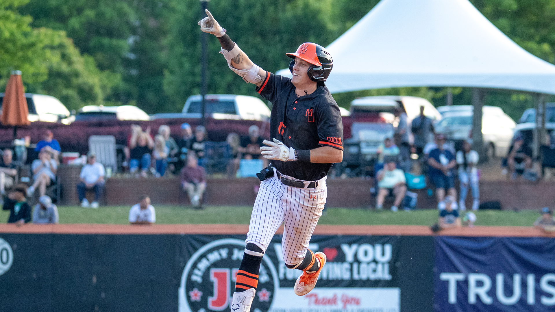 A Mercer baseball player runs the bases.