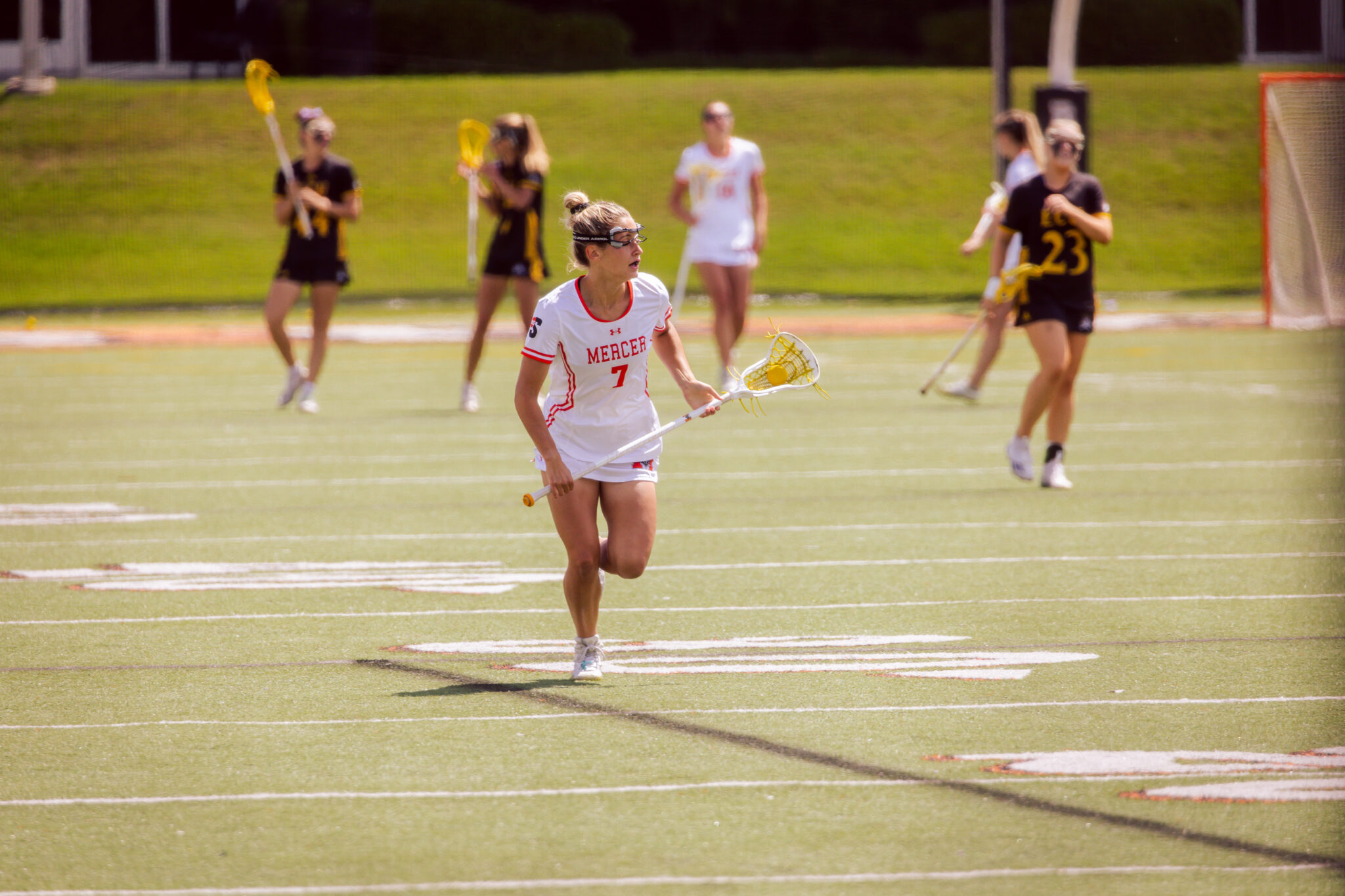 Mercer women's lacrosse players during a game.