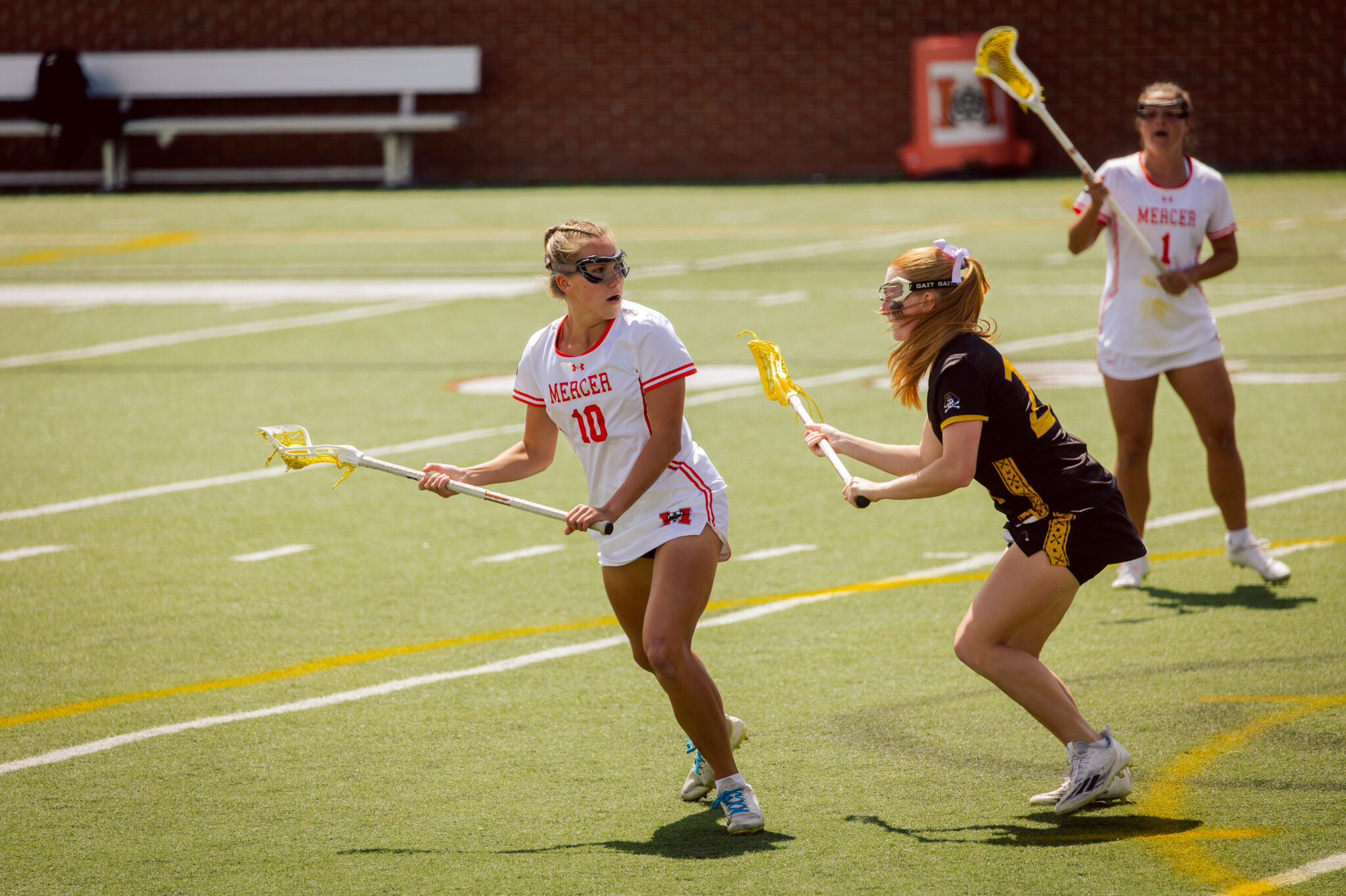 Mercer women's lacrosse players during a game.