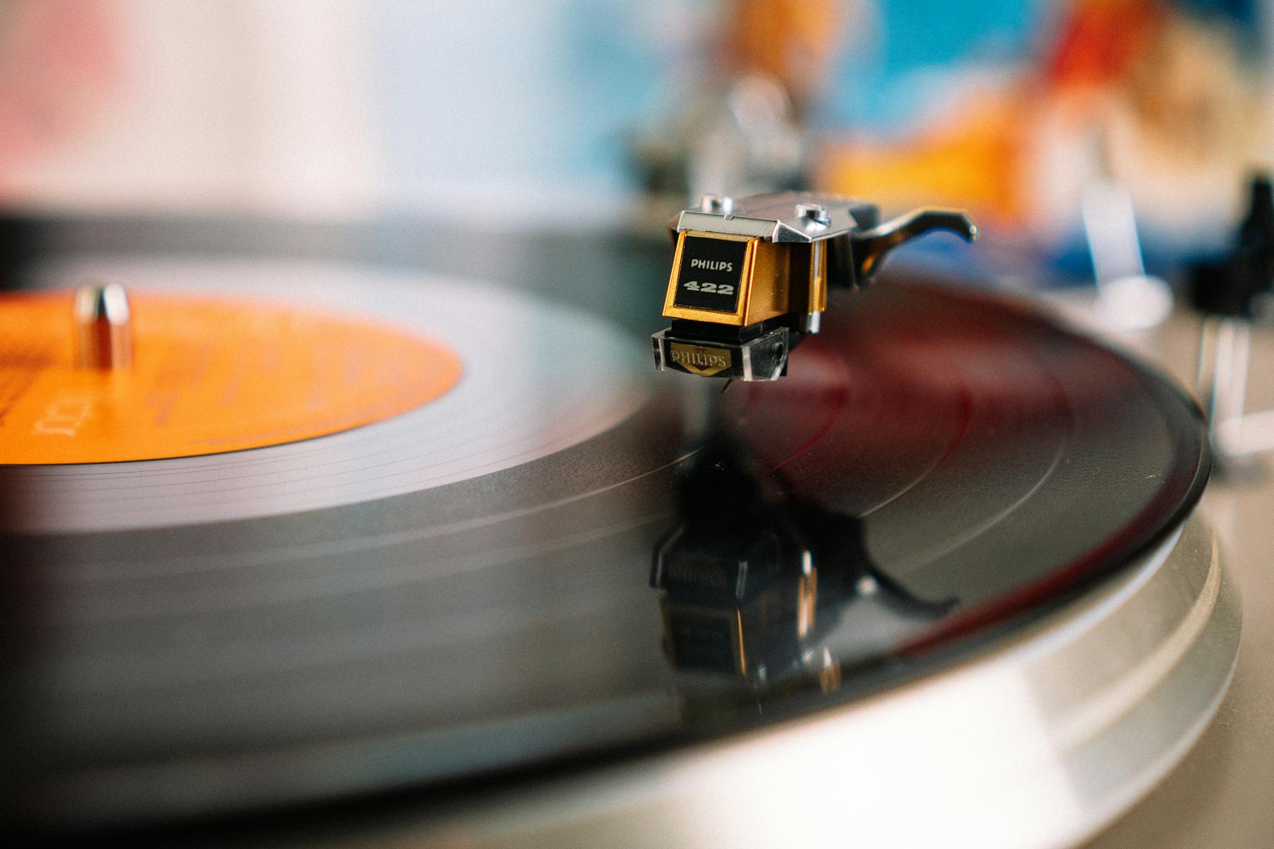 Retro turntable playing a vinyl record.