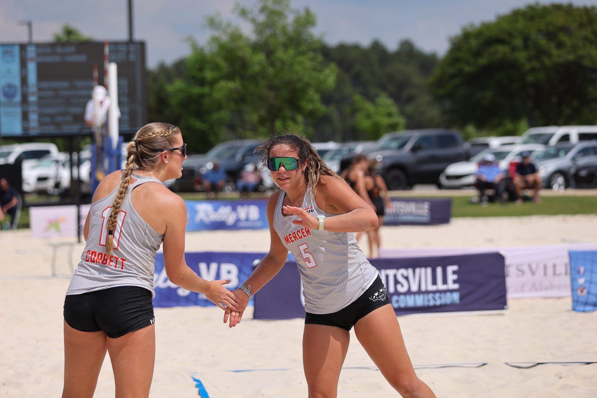 Two beach volleyball players during a match.