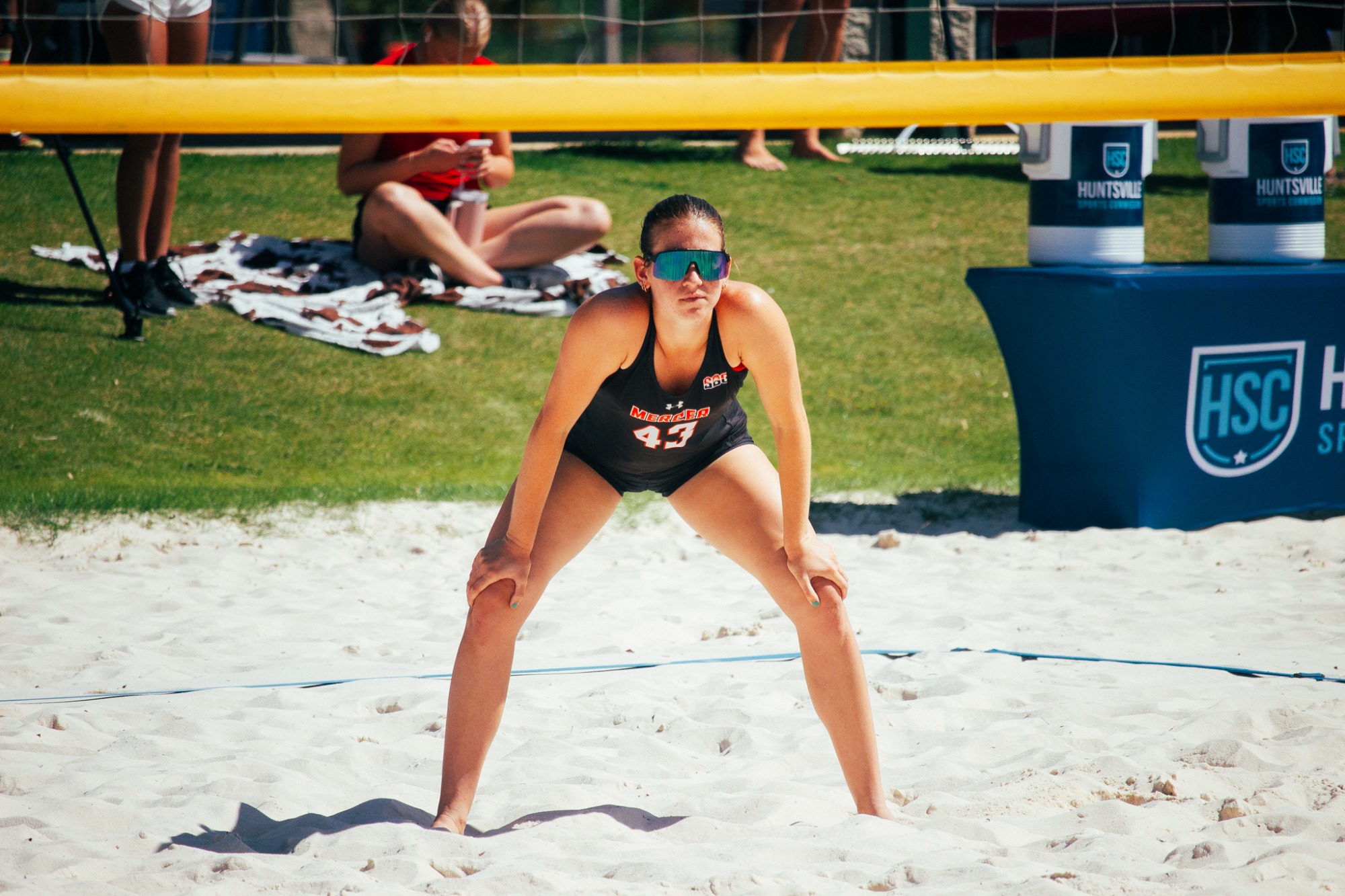 A Mercer beach volleyball player during a match.