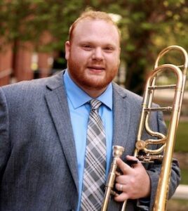 Trey English poses with his trombone.