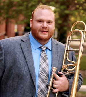 Trey English poses with his trombone.