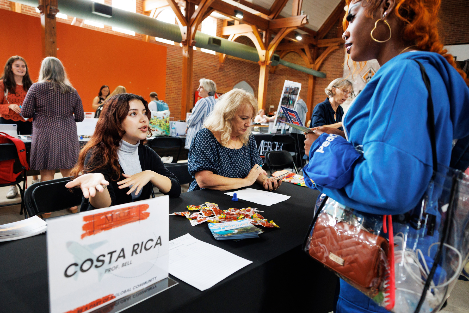 A Mercer student visits a table to learn about study abroad in Costa Rica during the 2024 Study Abroad Fair.