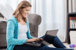 Woman working on laptop.