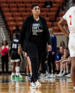 Mercer women's basketball coach Michelle Clark-Heard walks on the court during a game.