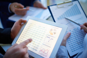 Close up of a financial report on a tablet.