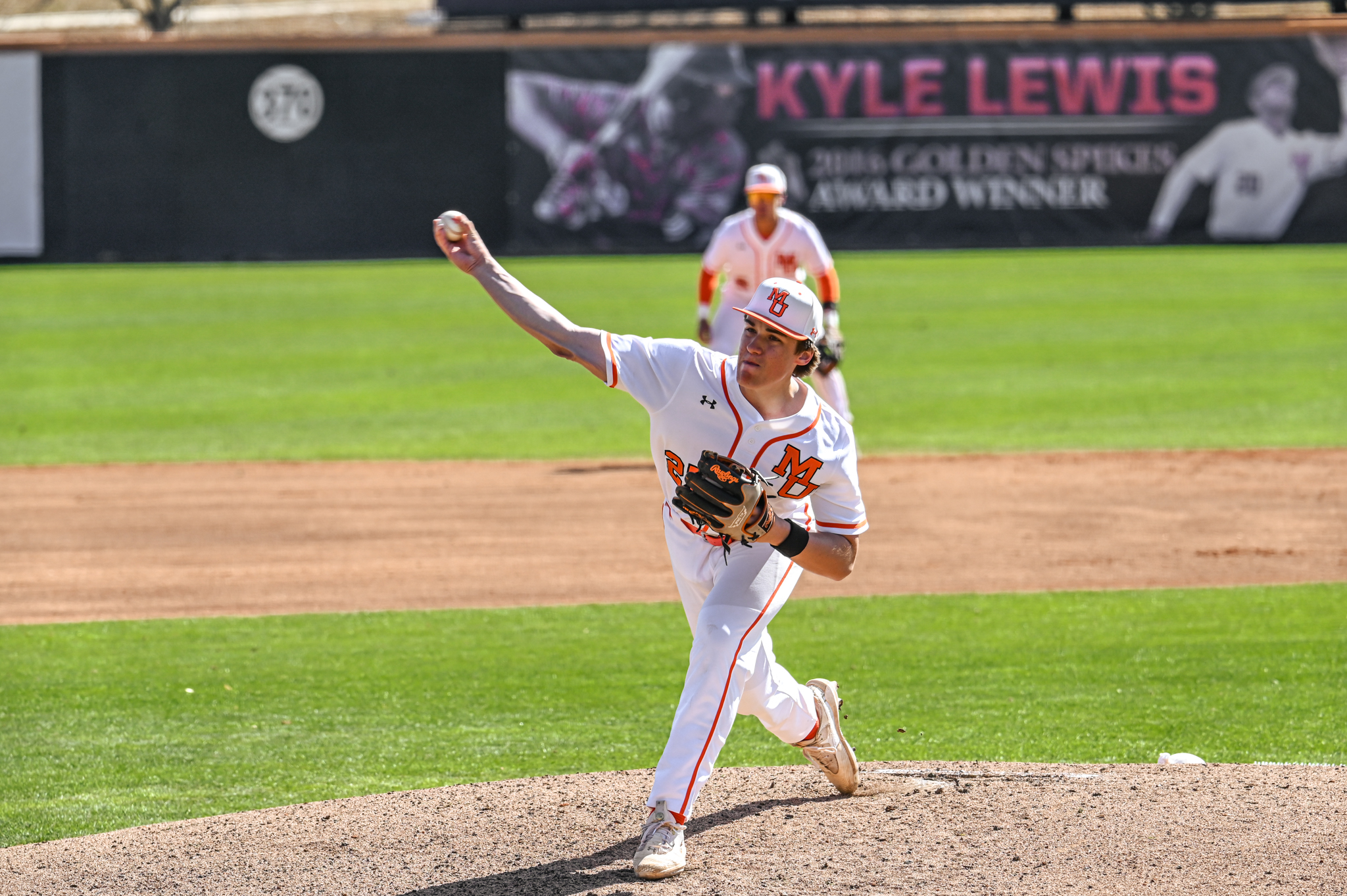 A Mercer baseball pitcher throws a pitch during a game.