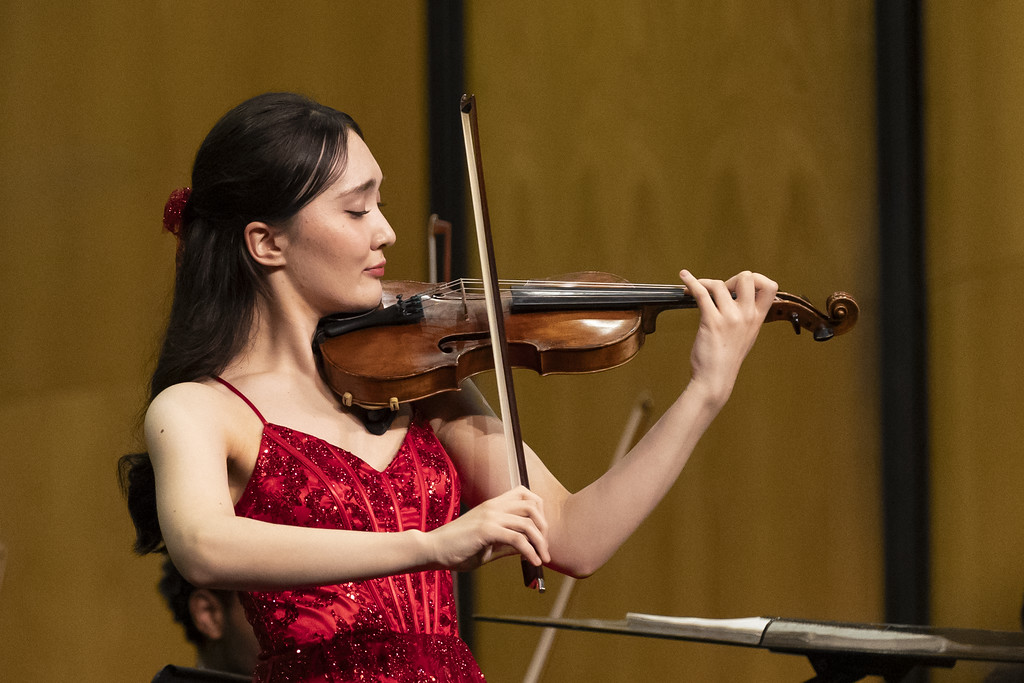 A woman plays the violin.