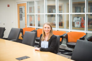A Mercer student sits at a table.