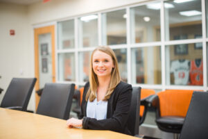 A Mercer student sits at a table.