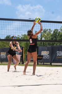 Mercer beach volleyball in action.