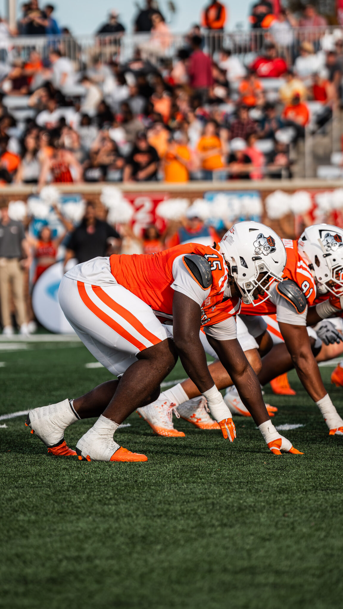 Mercer football players line up at the line of scrimmage during a game.