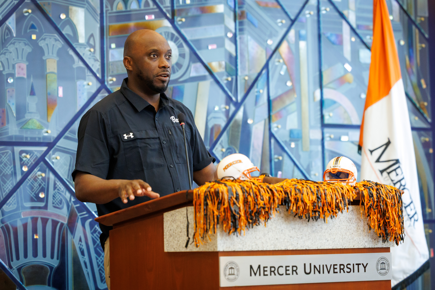 Joel Taylor speaks at an athletics news conference.