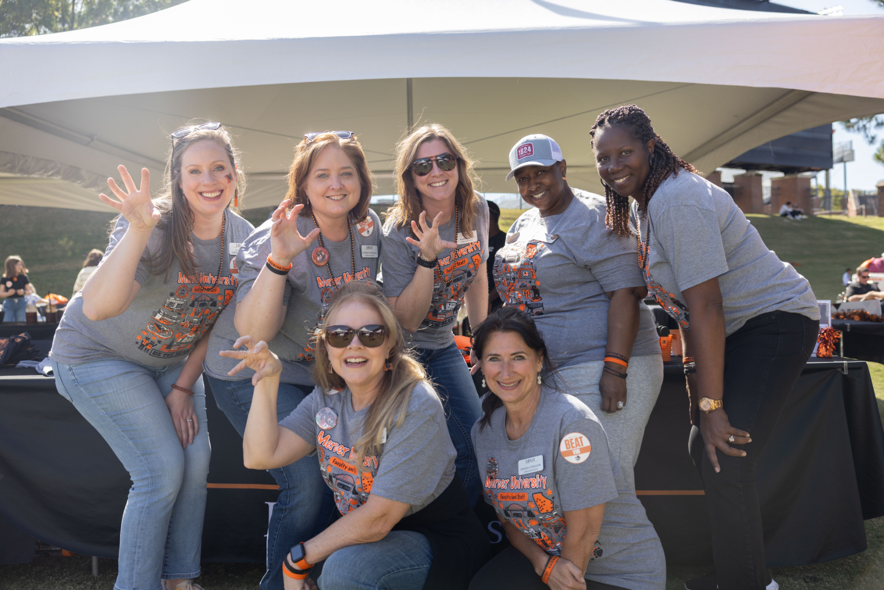 Mercer faculty members give the claw at faculty and staff appreciation day.