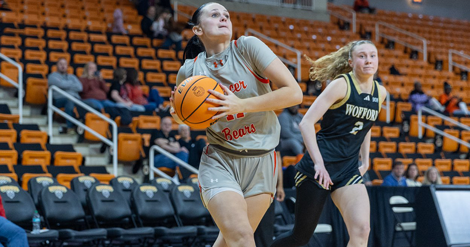 Mercer women's basketball player prepares to throw the ball.