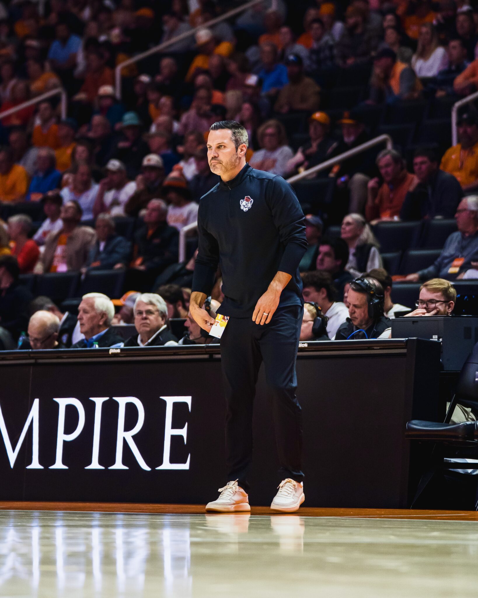 Mercer men's basketball coach Ryan Ridder on the court during a game.