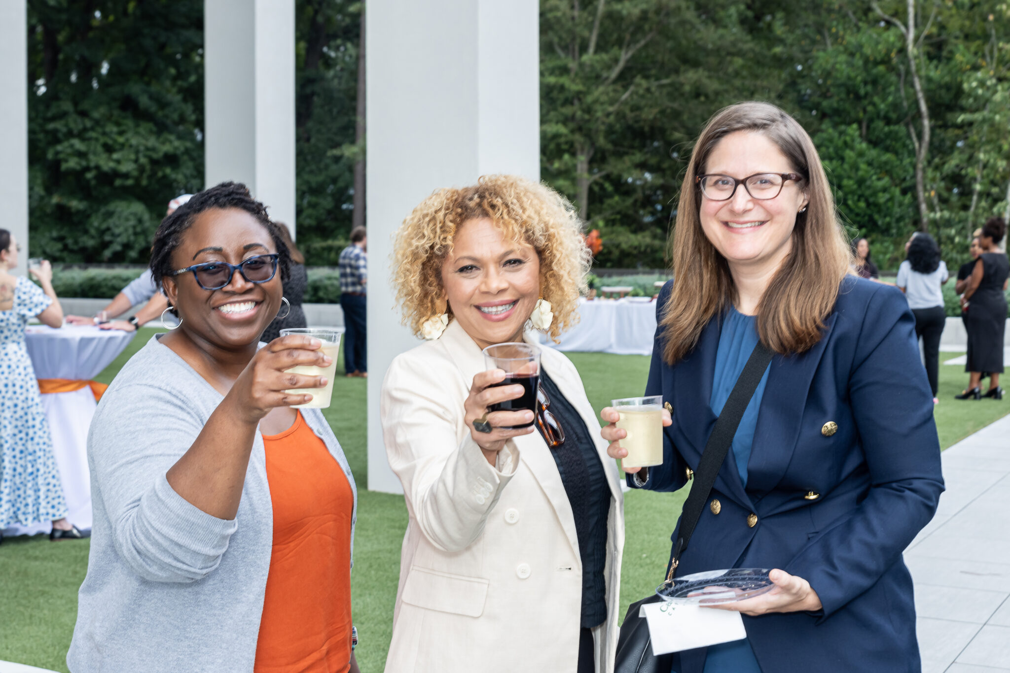 Three women toast at Cocktails with the Bears.